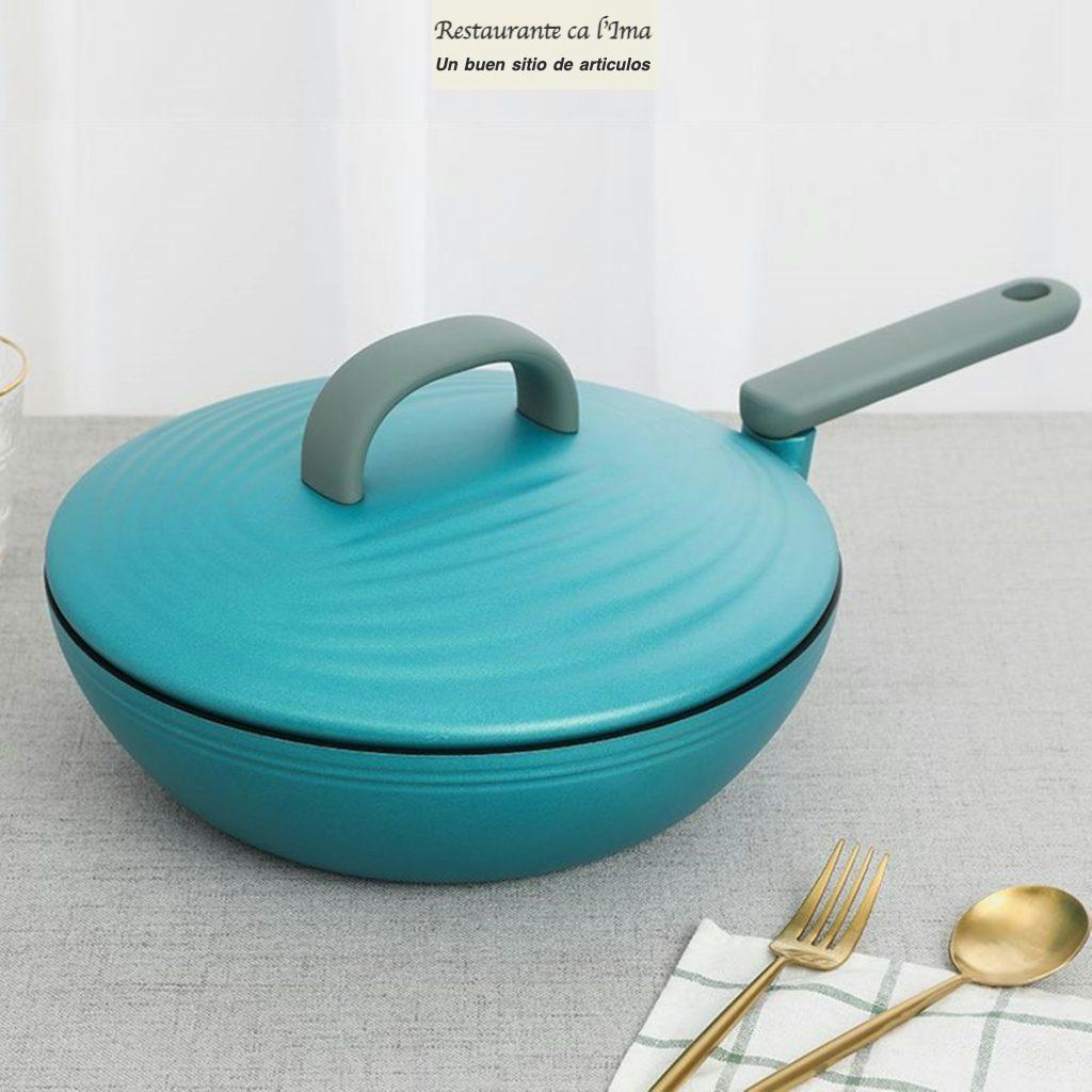 blue ceramic round bowl beside brown wooden fork