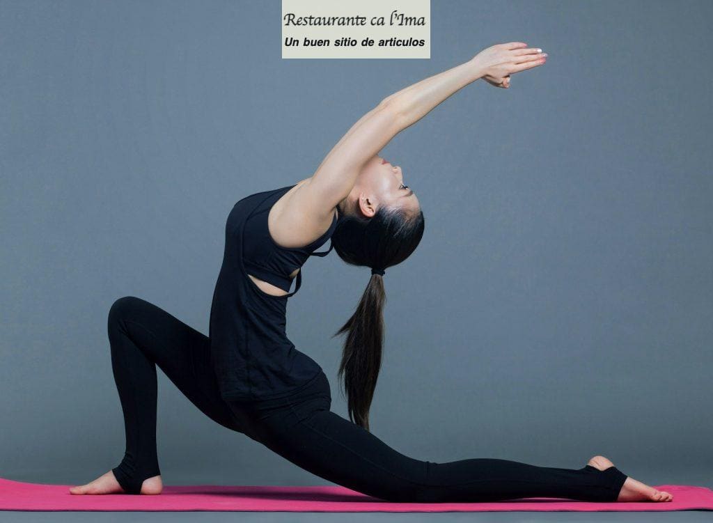 woman in black tank top and black pants doing yoga