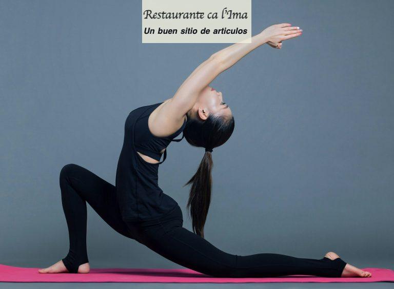 woman in black tank top and black pants doing yoga