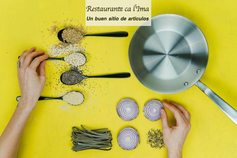 flat lay photography of saute skillet beside spoon of spices and vegetables